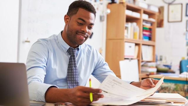 Teacher studying at desk