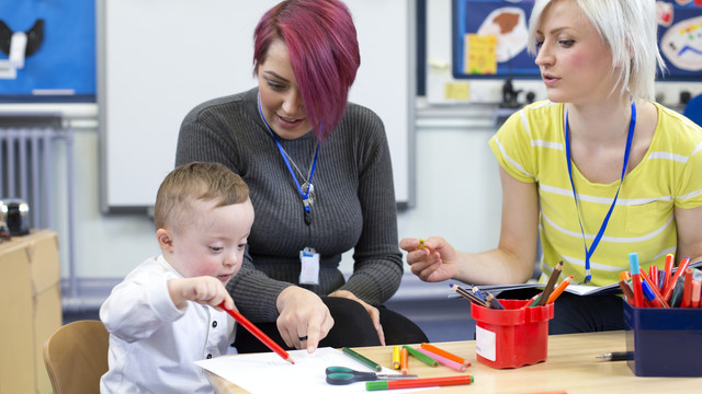 Teachers Working with Child